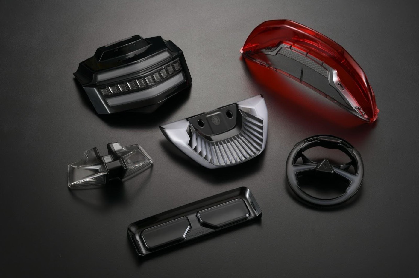Two-shot (2K) automotive lighting and trim assembly
